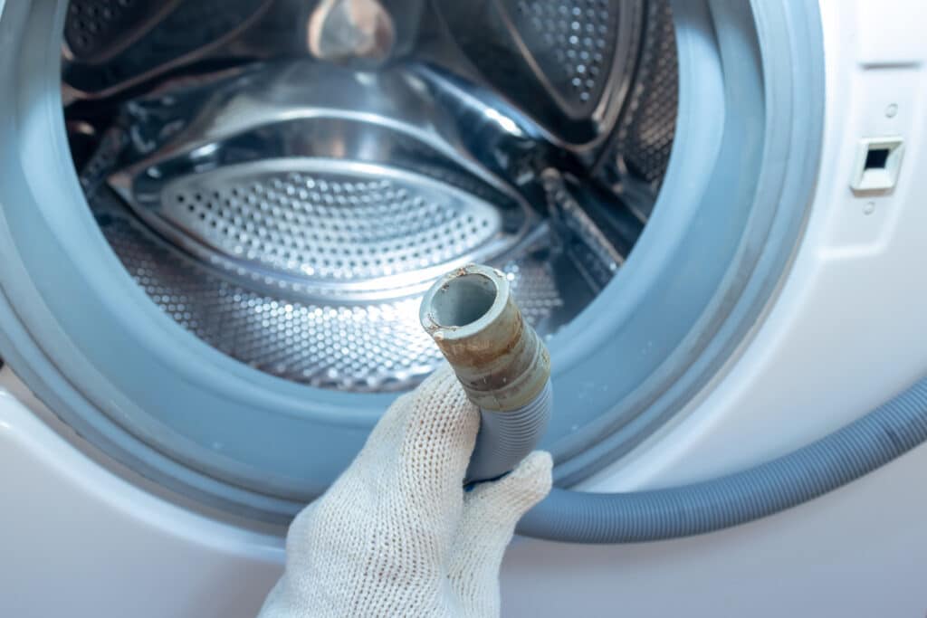 Example of a broken washing machine drain pipe.  This can cause water backups. 